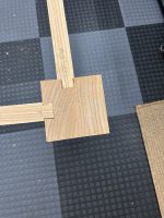 Hand-cut dovetail joint detail on a custom dining table