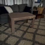 Solid walnut end table in a living room