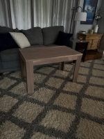 Solid walnut end table in a living room