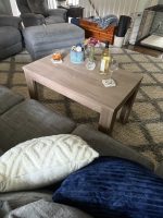 Walnut end table styled with drinks and flowers