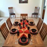 Custom rustic dining table with red accents, handcrafted in Indiana